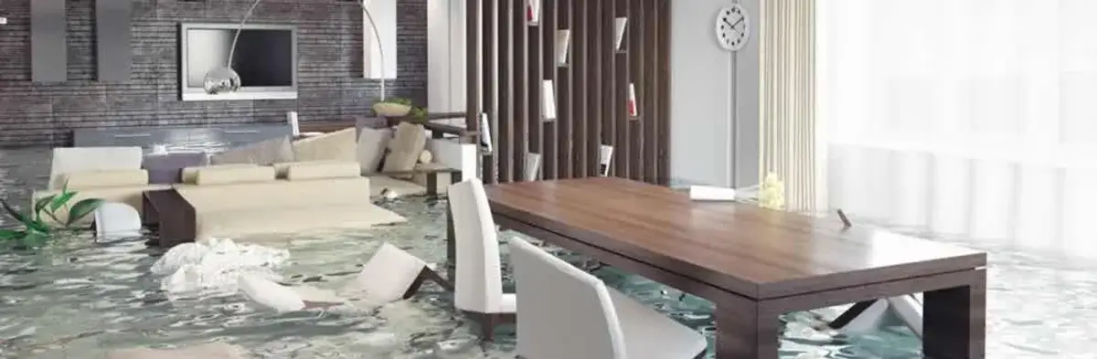 home interior affected by water damage with flooded floors and displaced furniture in Jacksonville, FL